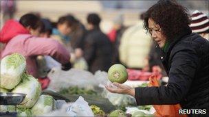 A woman buying vegetables in Beijing