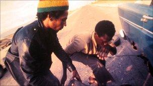 Bob Marley changing a tyre in Trinidad