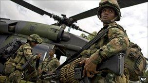 Colombian soldier boarding a helicopter, 9 March 2011