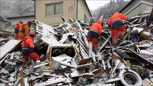 British rescuers search tsunami debris in Kamaishi