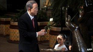 UN Secretary General Ban Ki-moon laying a rose on a peace memorial in Guatemala City