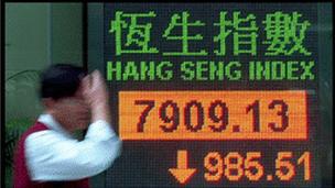 Man outside the Hong Kong stock exchange