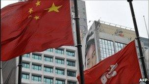 Chinese and Hong Kong flags outside hk stock exchange