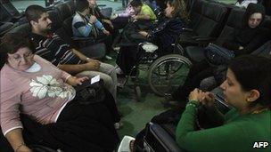 Iraqi Christians waiting to board a flight out of Iraq