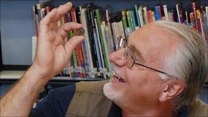 Dave Crisp with one of the Roman coins from the Frome Hoard