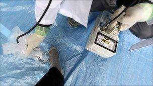 Man using a Geiger counter