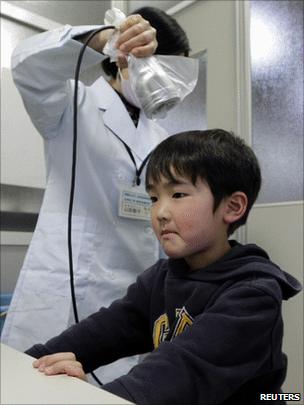 Boy being tested for radioactivity