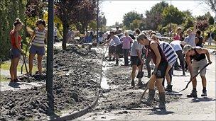 Student volunteers clearing liquefaction