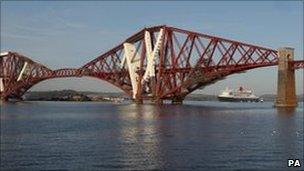 Cruise liner Queen Mary 2 under the Forth Rail Bridge