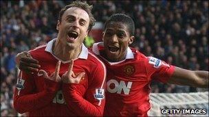 Dimitar Berbatov(left) and Antonio Valencia of Manchester United celebrate a goal against Bolton