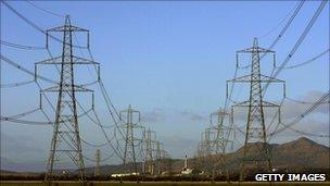 A row of large electricity pylons in Scotland