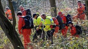 Police searching undergrowth