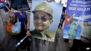 Government supporters with posters of President Castro