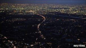 Lights are turned off during rolling blackouts in Misato City