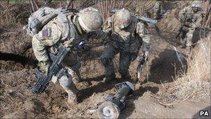 Soldiers from 1st Battalion, Irish Guards during an operation in Afghanistan, March 2011.