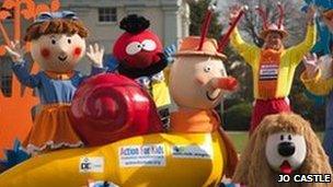 Lloyd Scott (right) surrounded by Magic Roundabout characters. (Credit: Jo Castle)