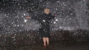 Waves crashing over sea wall at Tywyn, Gwynedd (Pic: Simon Robinson)