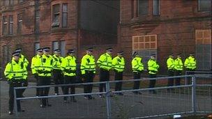 Police attend the eviction