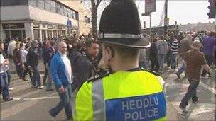 Police officer and football fans