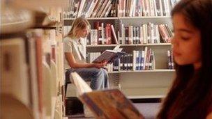 Reading books in a library