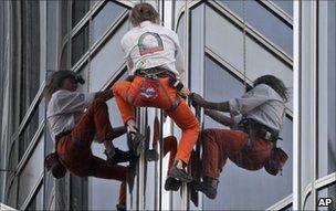 Alain Robert climbs the Burj Khalifa in Dubai, 28 March