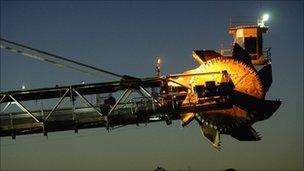 A reclaimer places coal in stockpiles after processing at Rio Tinto's mine