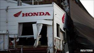 A Honda sign at a building damaged by the 11 March tsunami in Kesennuma town, Miyagi Prefecture