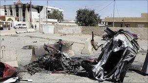 Destroyed car in front of the provincial council building of Tikrit, Iraq, 30 March 2011