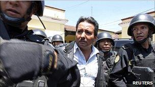 Drug suspect Juan Ortiz Lopez is escorted by police in Guatemala - file photo
