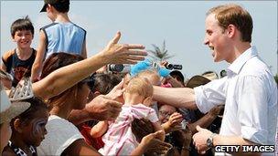 Prince William with crowd of people