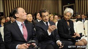 Chinese vice premier Wang Qishan with Nicolas Sarkozy and Christine Lagarde