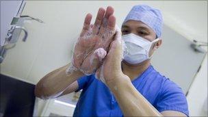 doctor scrubbing up before operation