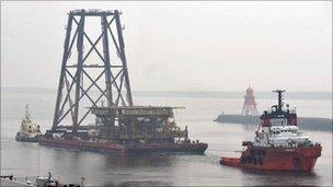 The first of eight barges arriving on a barge