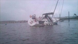 Boat on its side at Pwllheli harbour