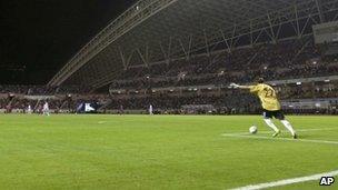 National team goal keeper Guan Zhen kicks the ball in a friendly against Costa Rica on 26 March 2011