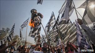 Protesters in Lahore burn Mr Jones in effigy on 25 March