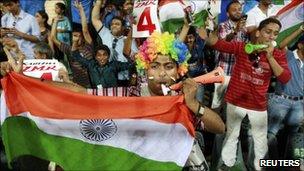 Fans celebrate as India secure a win over Sri Lanka in the cricket World Cup final - 02 April 2011