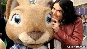 Russell Brand and companion at the Hop premiere in Los Angeles