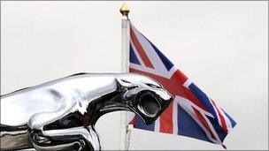 A silver Jaguar emblem is pictured outside a Jaguar car sales dealership in Manchester