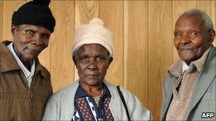 Ndiku Mutua (left), Jane Muthoni Mara (centre) and Wambugu wa Nyingi (right) pose for photographs in central London, on 6 April 2011. The three together with fellow Kenyan Paulo Nzili (not pictured) are claiming compensation for alleged acts of brutality against them by Britain's colonial government during the 1950's Mau Mau rebellion in their country.