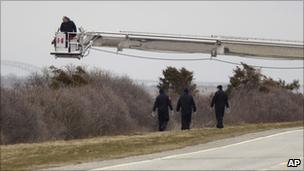 Emergency workers search scrubland in Oak Beach, 4 April