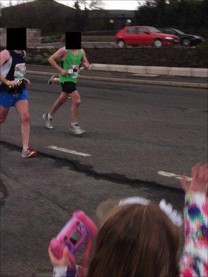 Police think the bomb had already been planted under Constable Ronan Kerr's black Ford Mondeo (top right) when these runners passed close to it