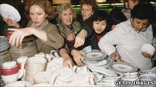 Women grabbing crockery