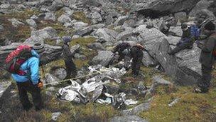 Scouts measuring the wreckage of an Avro Anson