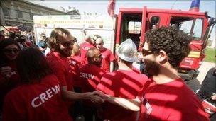 Expedition leader Steve Moore (left, wearing sunglasses) celebrates with the Follow That Fire Engine team members