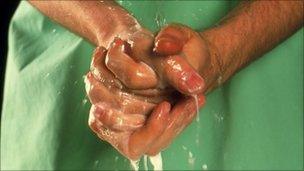 Surgeon scrubbing hands