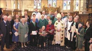 A group shot of award winners with Archbishop and others