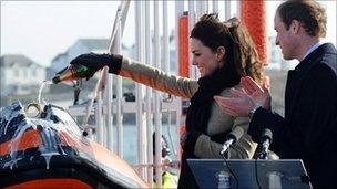 Catherine Middleton and Prince William launch a lifeboat at Treaddur Bay on Anglesey