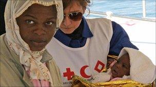 A woman migrants and her baby