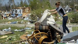 Melissa Jernigan sorts through the remains of her North Carolina home